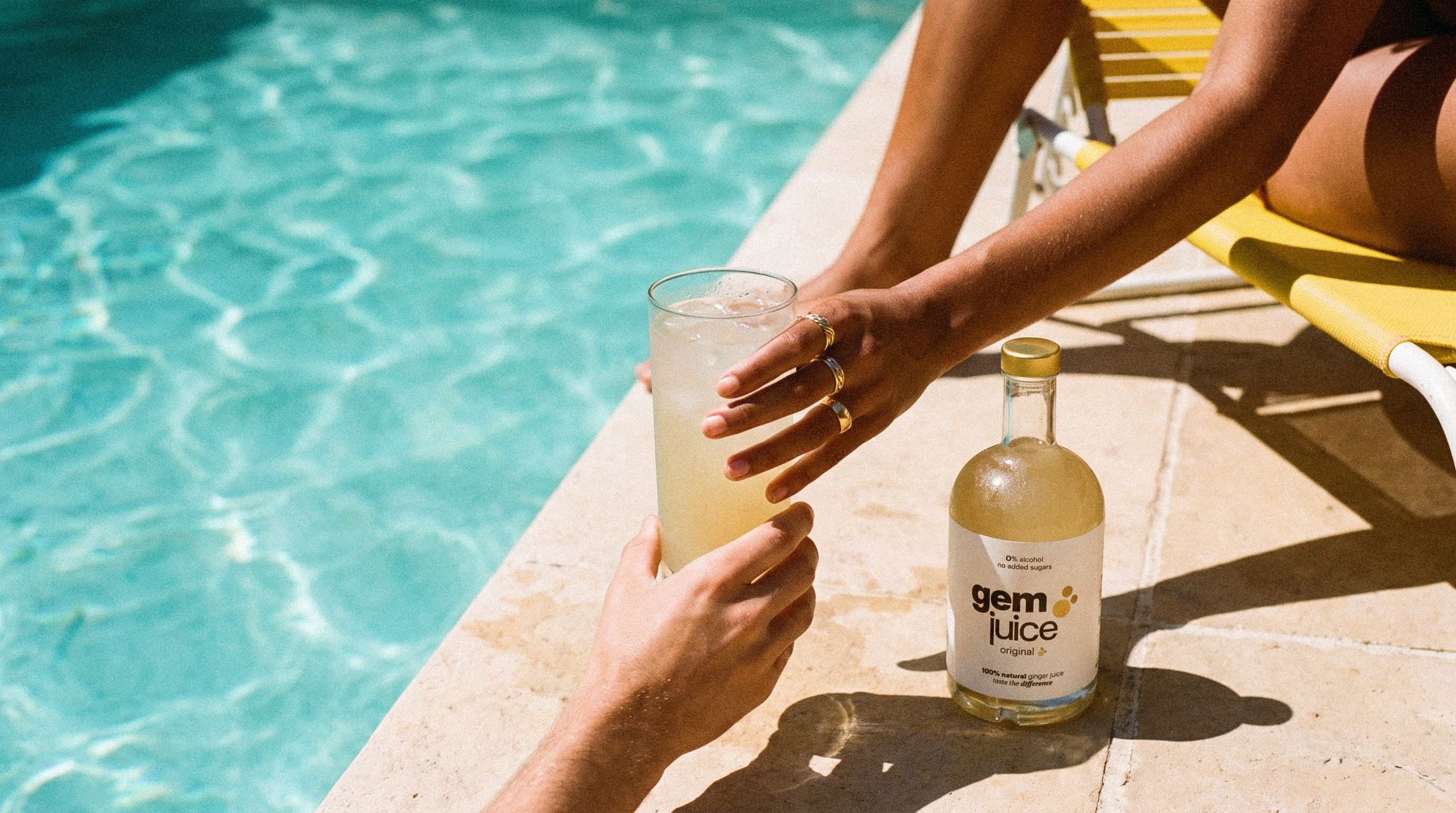 Gem Juice Original passed poolside, the ginger drink that does it all